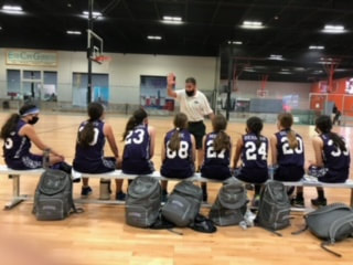 Coach Jeff offering guidance to his eight-grade girls’ travel team.