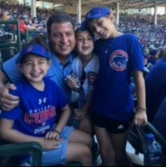 Jeff and the kids at a Cubs game.